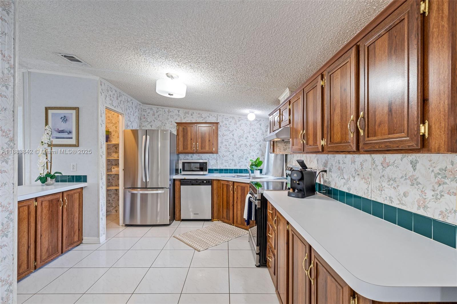 278 King Avenue Key Largo, FL 33037 - Photo 21 of 58 a kitchen with a sink stove and refrigerator