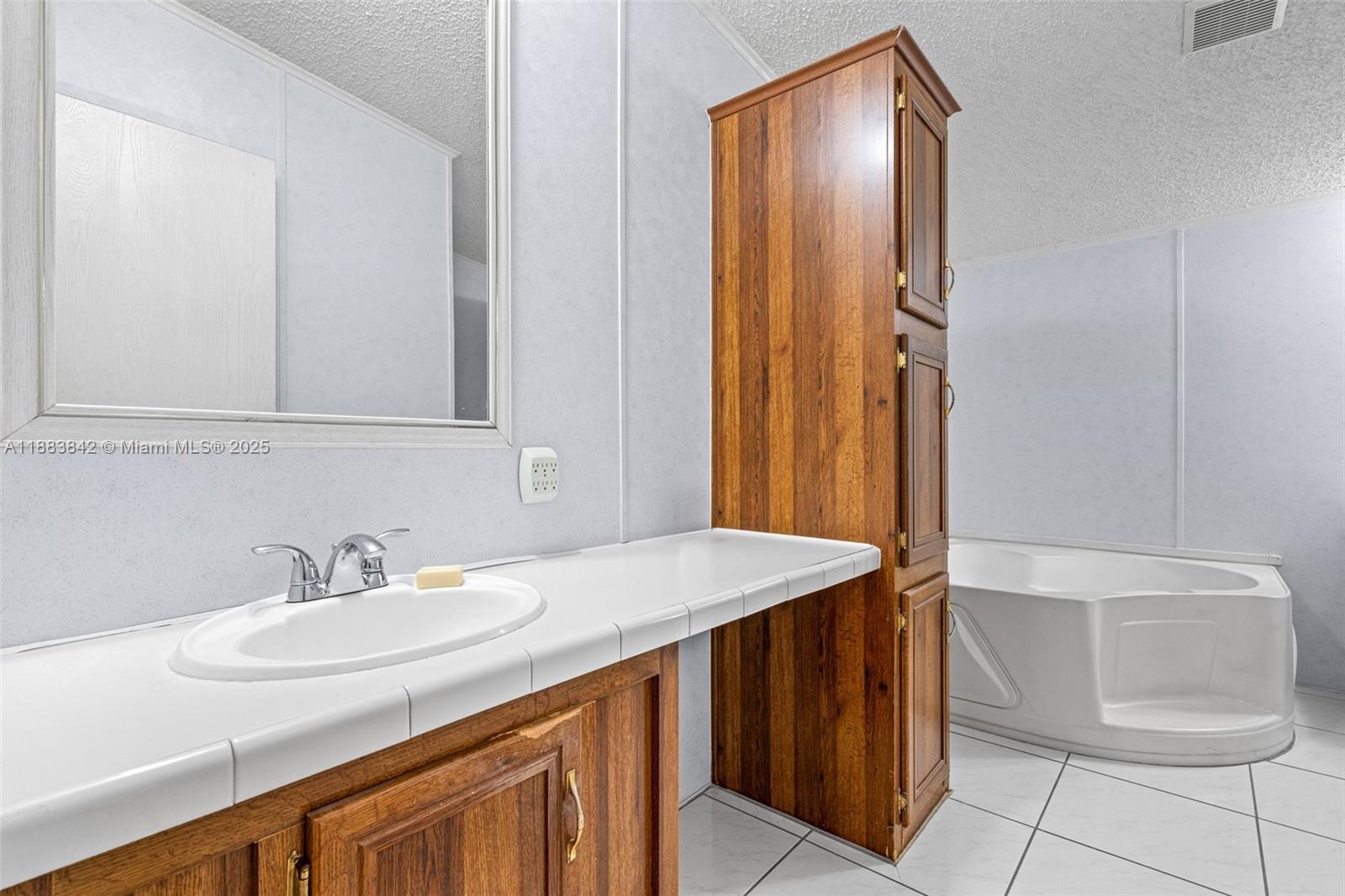 278 King Avenue Key Largo, FL 33037 - Photo 29 of 58 a bathroom with a sink a toilet and a mirror