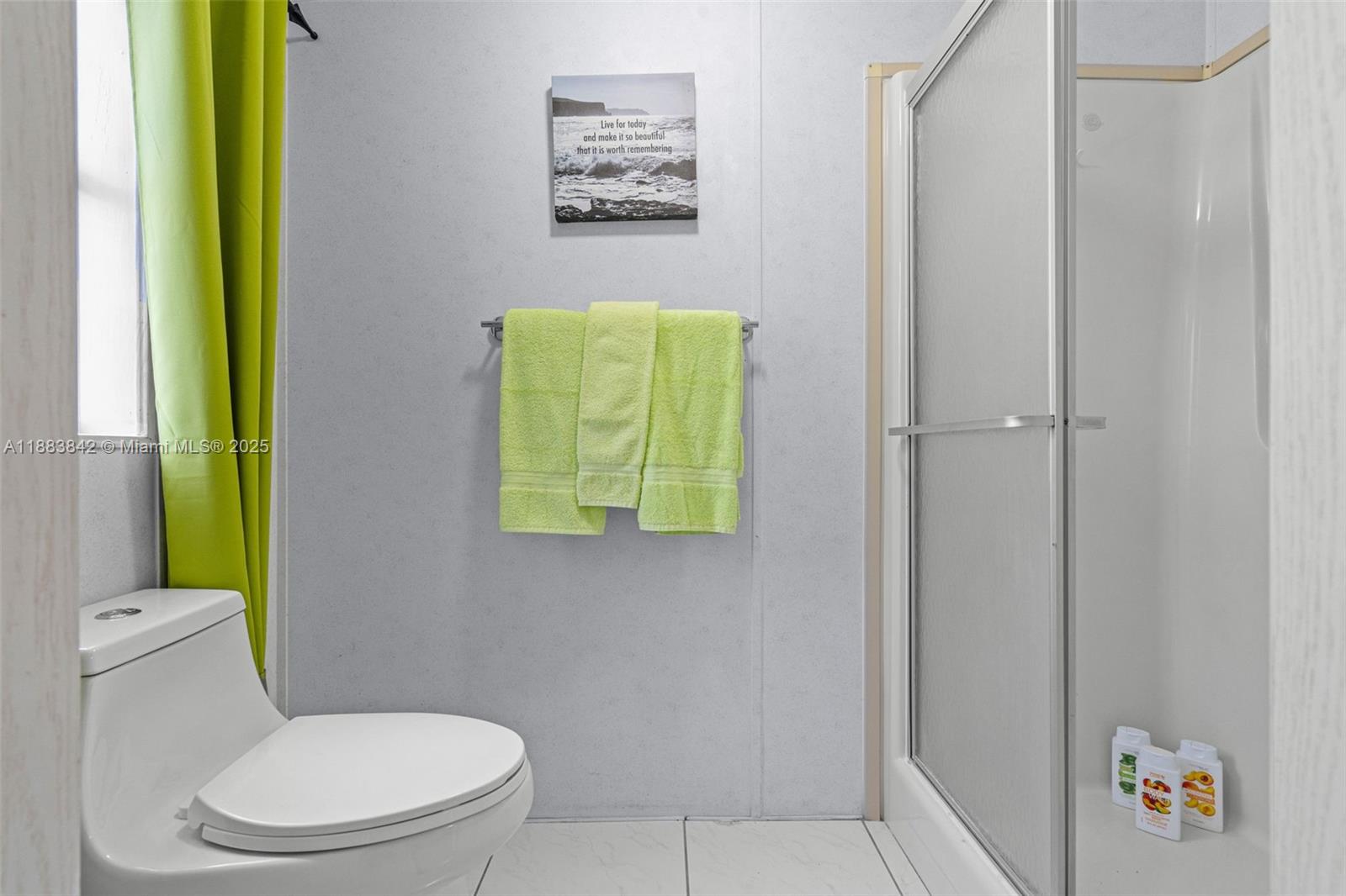 278 King Avenue Key Largo, FL 33037 - Photo 32 of 58 a white toilet sitting next to a bathroom sink and vanity