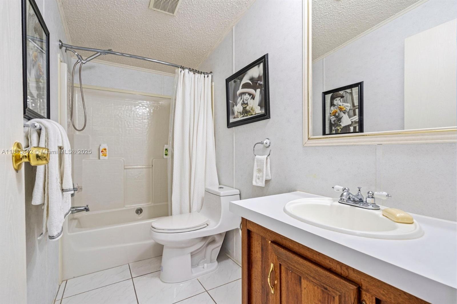 278 King Avenue Key Largo, FL 33037 - Photo 36 of 58 a bathroom with a granite countertop sink toilet and shower