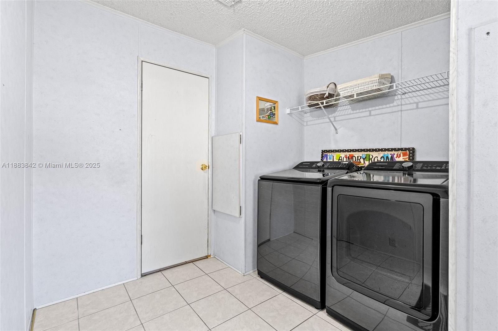 278 King Avenue Key Largo, FL 33037 - Photo 40 of 58 a utility room with washer and dryer