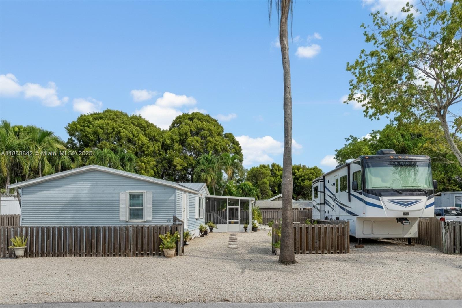 278 King Avenue Key Largo, FL 33037 - Photo 4 of 58 a view of a chair and tables in the patio