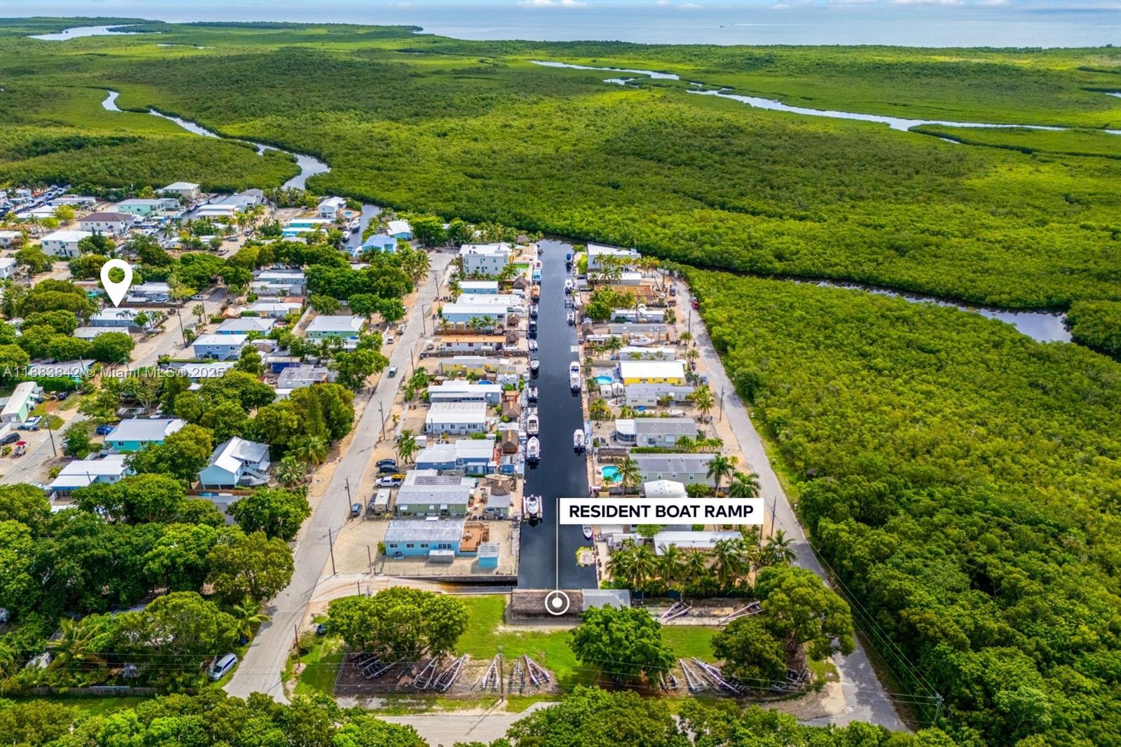 278 King Avenue Key Largo, FL 33037 - Photo 47 of 58 a view of a large building with a yard