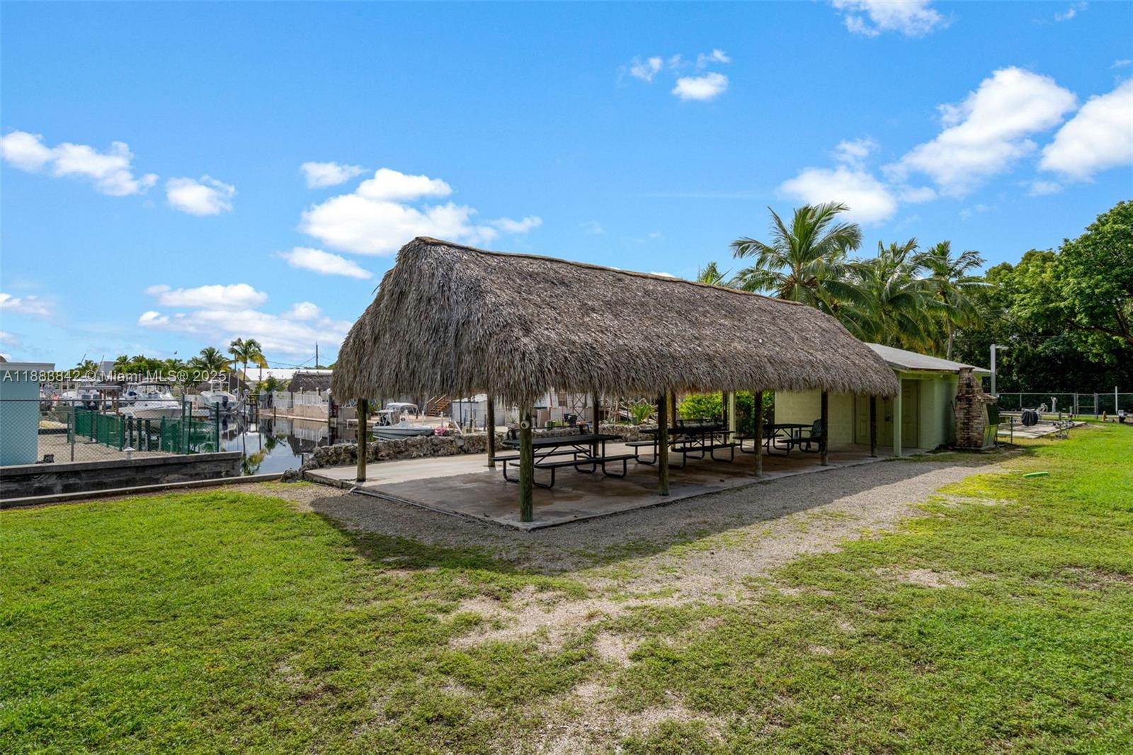 278 King Avenue Key Largo, FL 33037 - Photo 56 of 58 a view of a house with swimming pool and sitting area