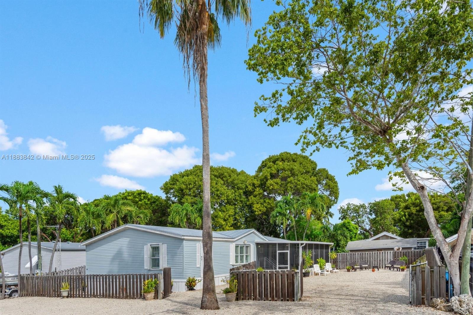 278 King Avenue Key Largo, FL 33037 - Photo 7 of 58 a front view of a house with garden