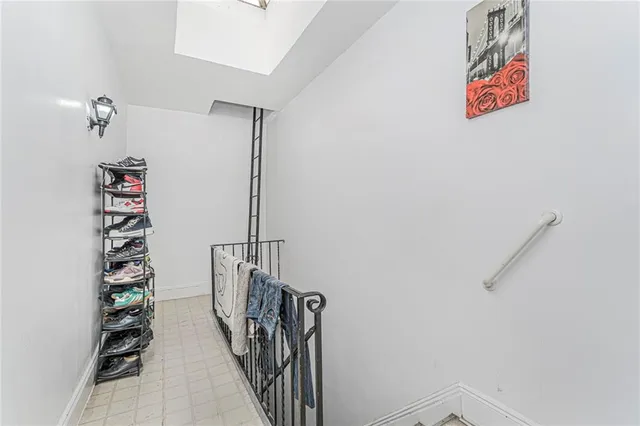 a view of an empty room and wooden floor