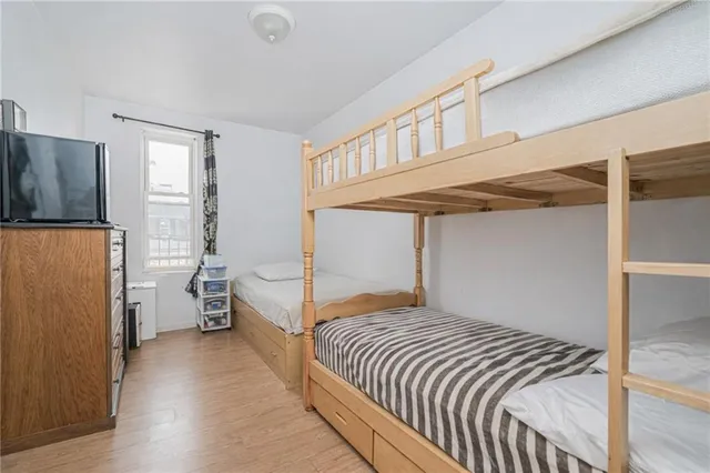 a bedroom with a bed and a lamp