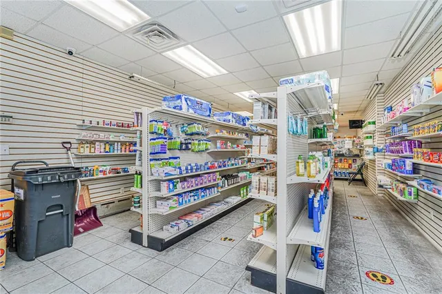 a room with lots of books and a large window