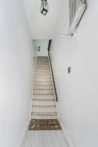 a view of a livingroom with furniture and closet area