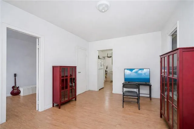 a kitchen with a stove top oven and a refrigerator