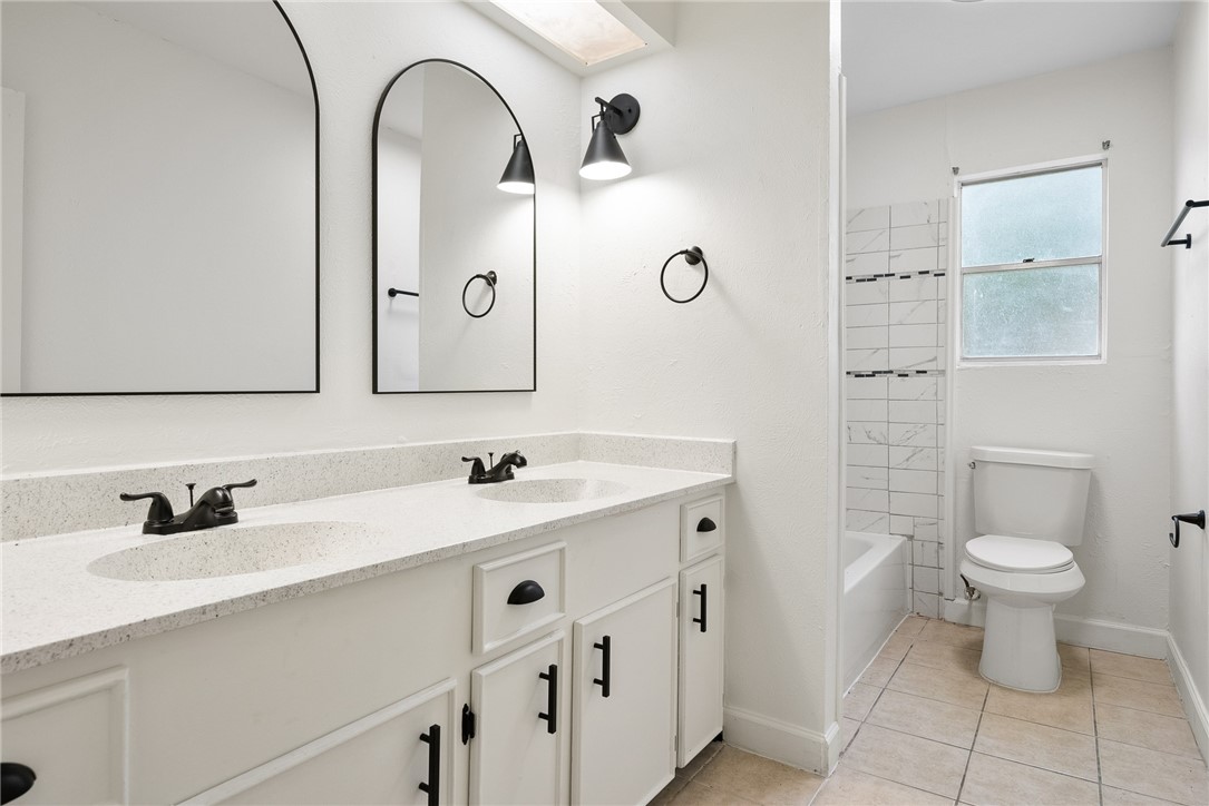 5009 Wingfoot Lane, Unit B Corpus Christi, TX 78413 - Photo 14 of 23 a bathroom with a sink and a toilet