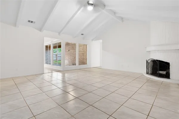 an empty room with fireplace