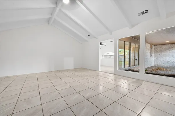 a view of a bathroom with a glass door shower and a sink