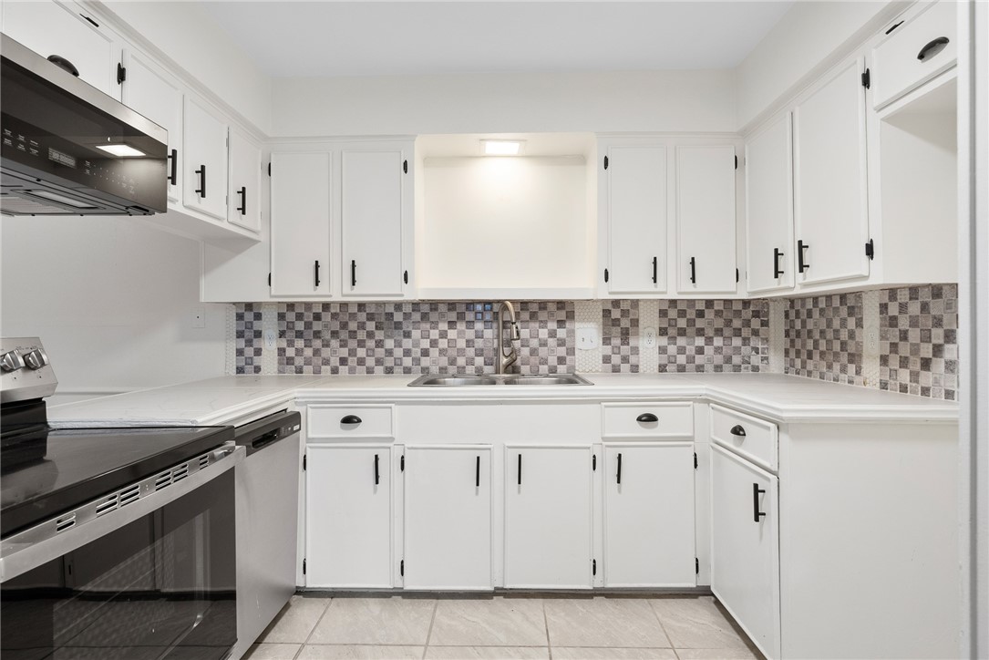 5009 Wingfoot Lane, Unit B Corpus Christi, TX 78413 - Photo 10 of 23 a view of white cabinets