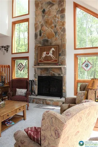 a bedroom with furniture and a fireplace