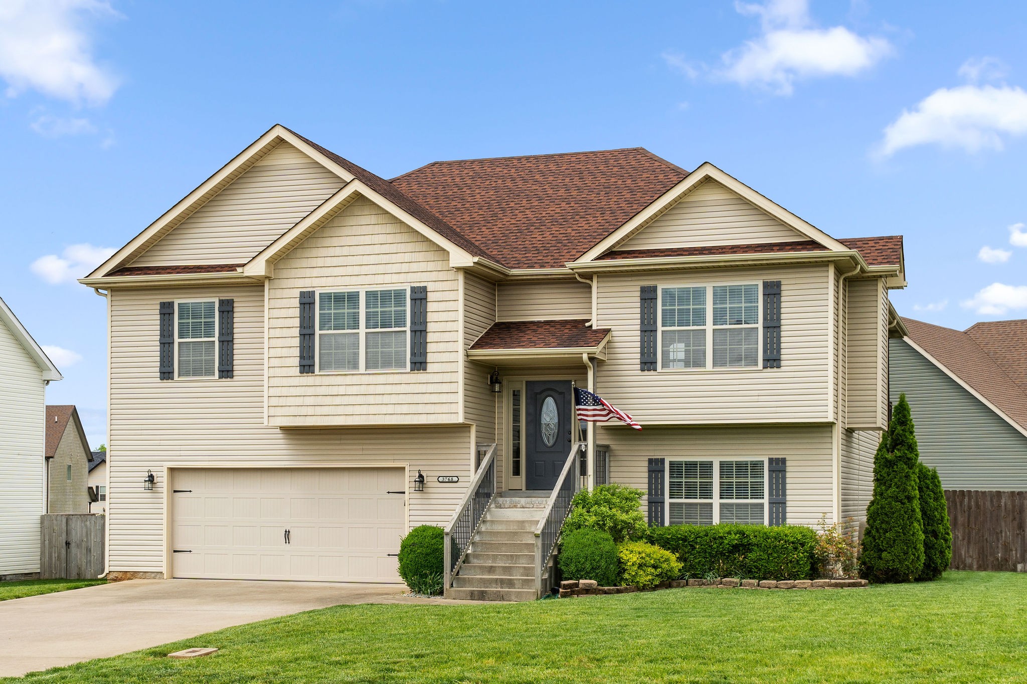 3768 Suiter Road Clarksville, TN 37040 - Photo 1 of 28 a front view of a house with a yard and garage