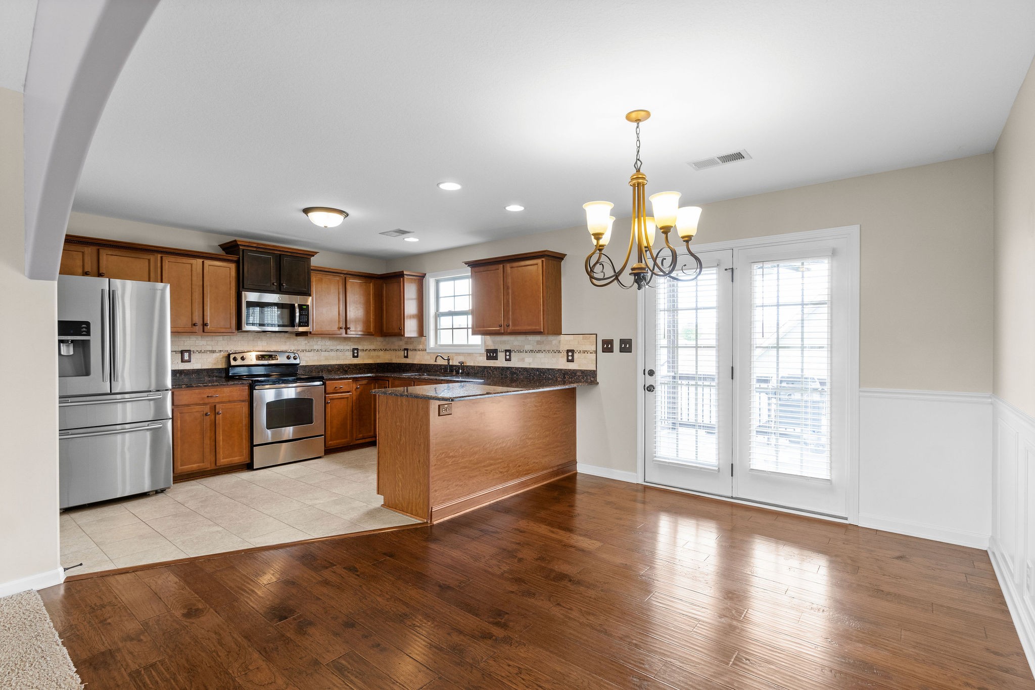 3768 Suiter Road Clarksville, TN 37040 - Photo 11 of 28 a kitchen with granite countertop stainless steel appliances and refrigerator