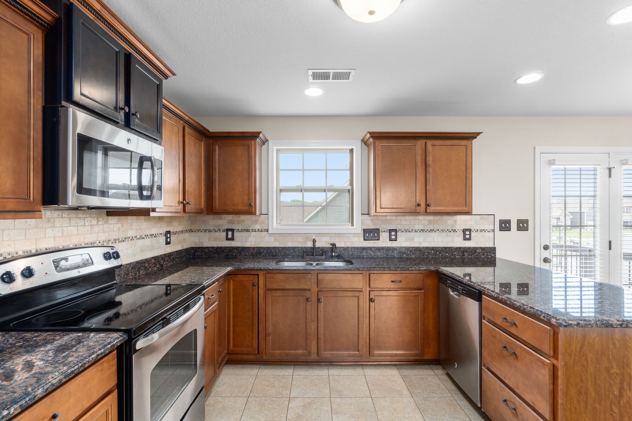 3768 Suiter Road Clarksville, TN 37040 - Photo 14 of 28 a kitchen with a sink stove and cabinets