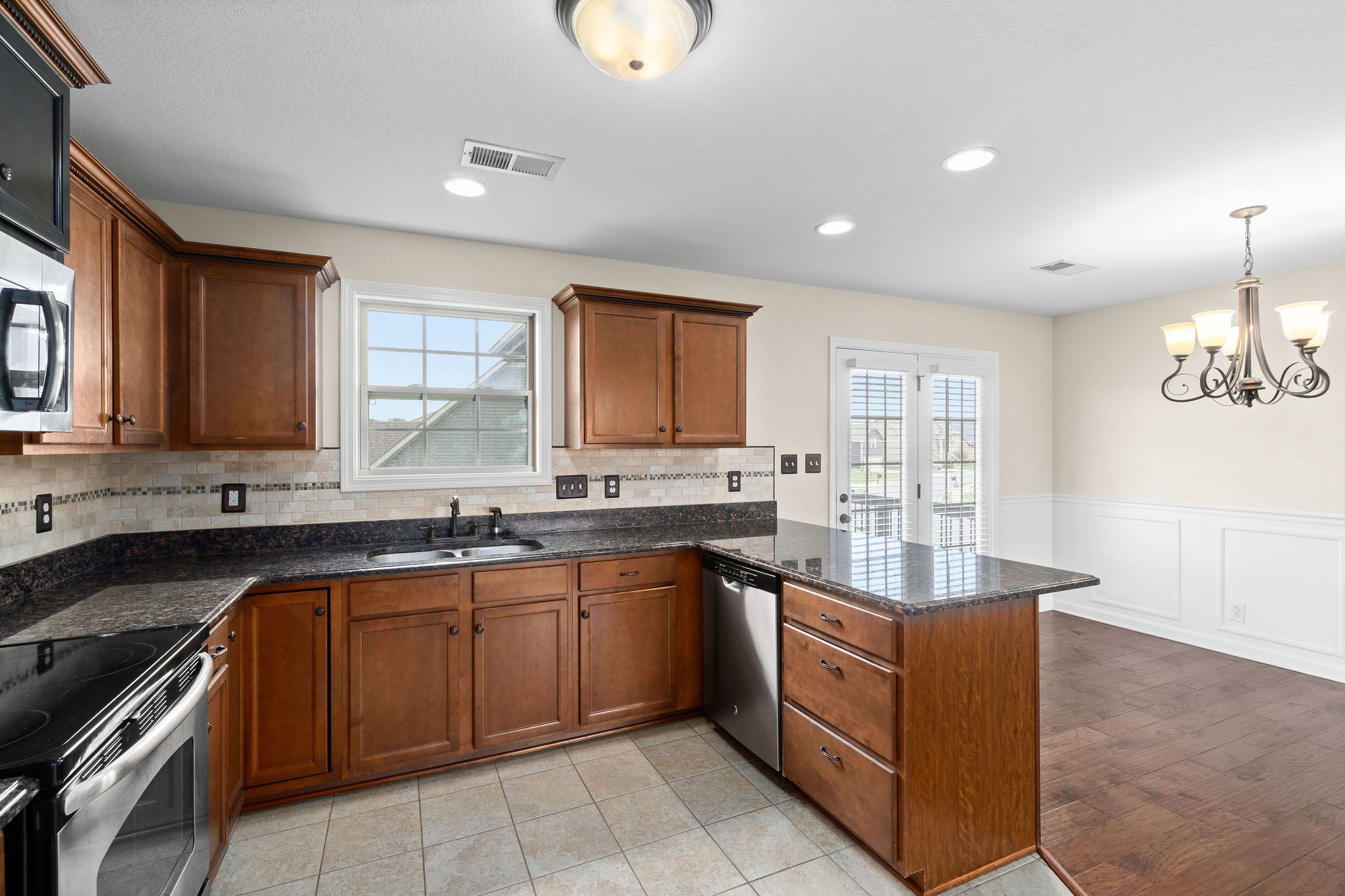 3768 Suiter Road Clarksville, TN 37040 - Photo 15 of 28 a kitchen with sink stove and cabinets