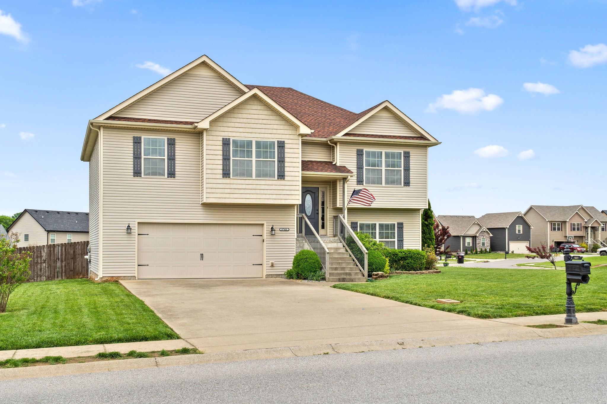 3768 Suiter Road Clarksville, TN 37040 - Photo 3 of 28 a front view of a house with a yard and garage