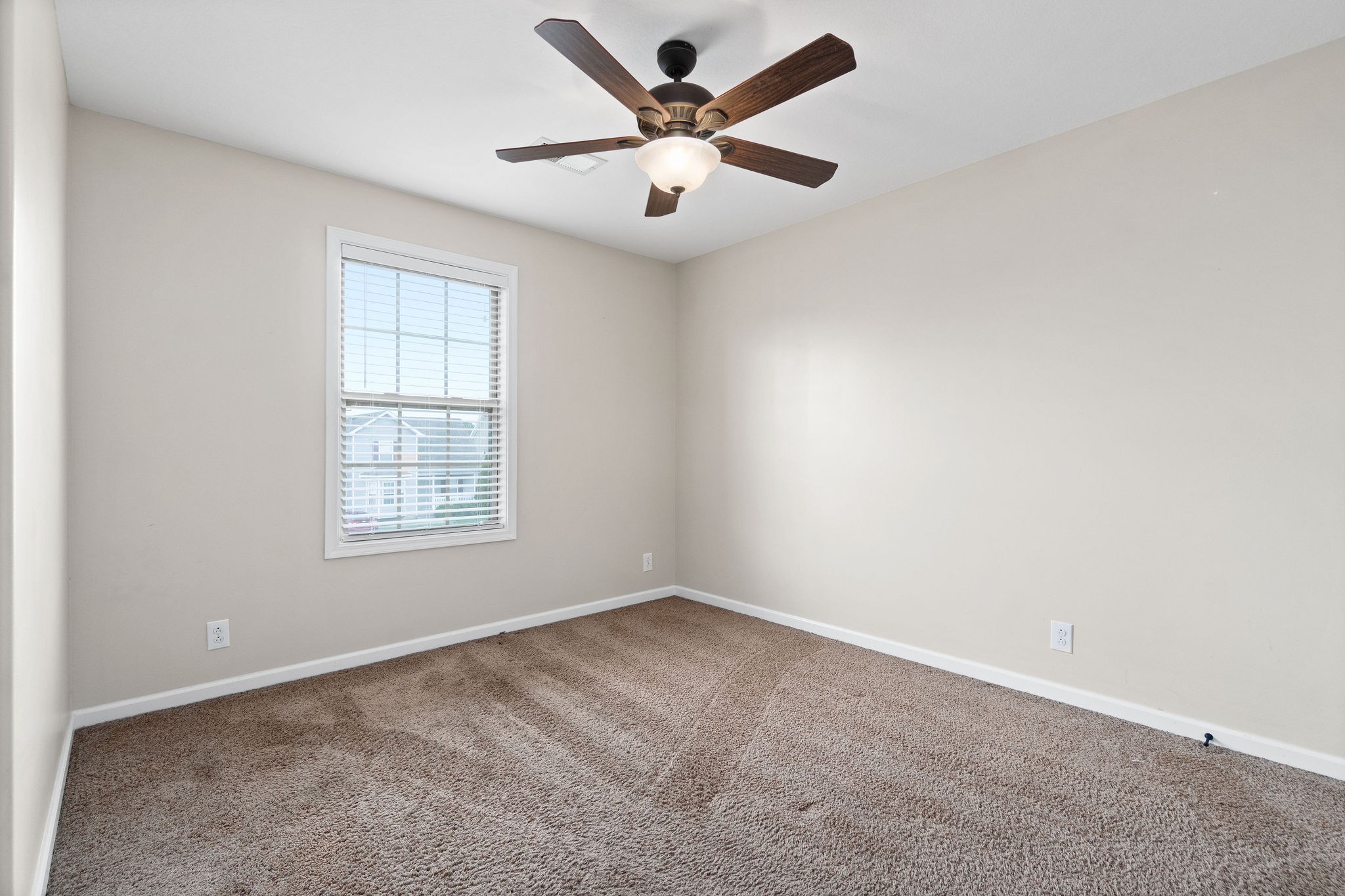 3768 Suiter Road Clarksville, TN 37040 - Photo 21 of 28 an empty room with windows and fan