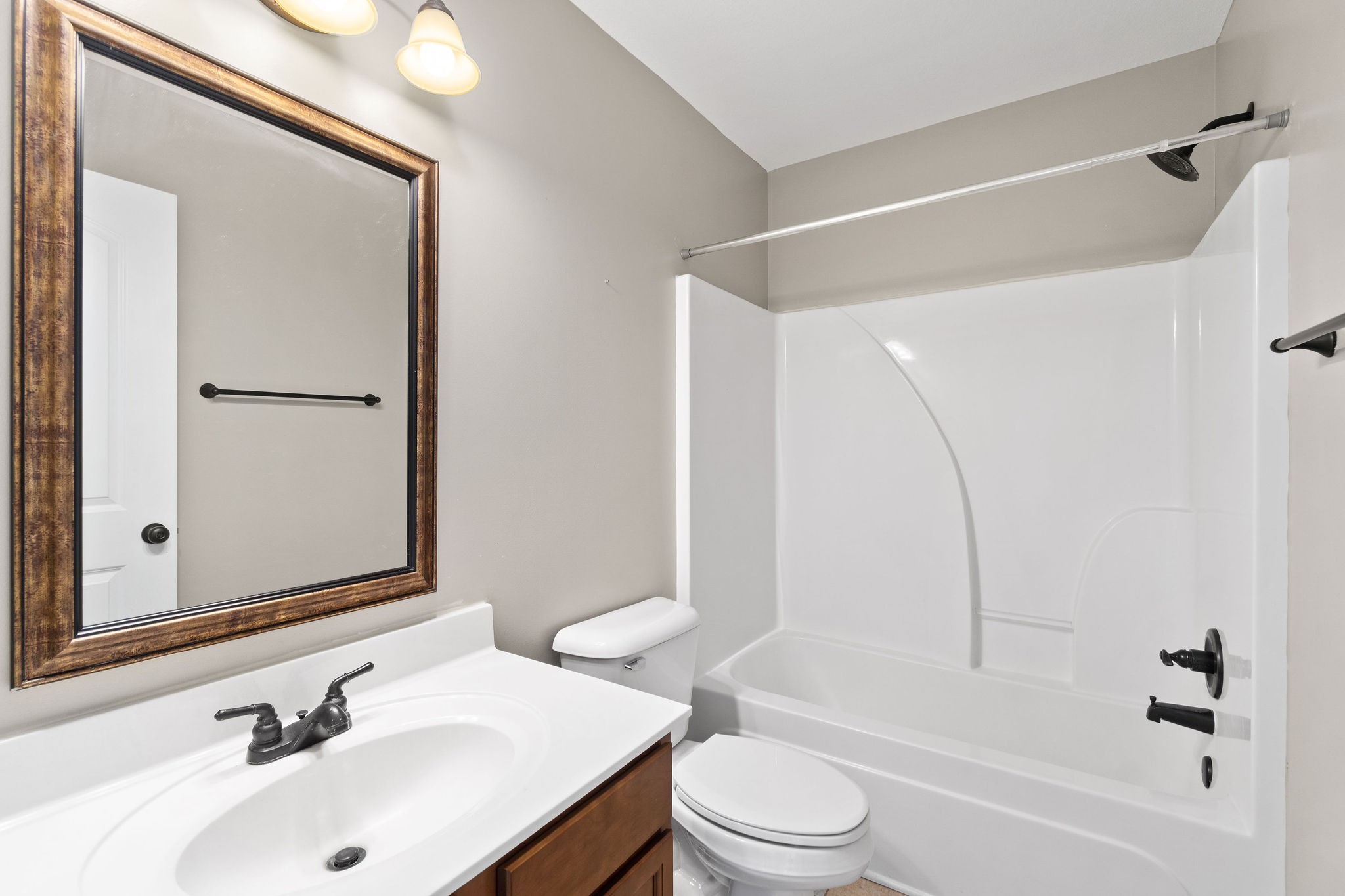 3768 Suiter Road Clarksville, TN 37040 - Photo 23 of 28 a bathroom with a sink mirror toilet and bathtub