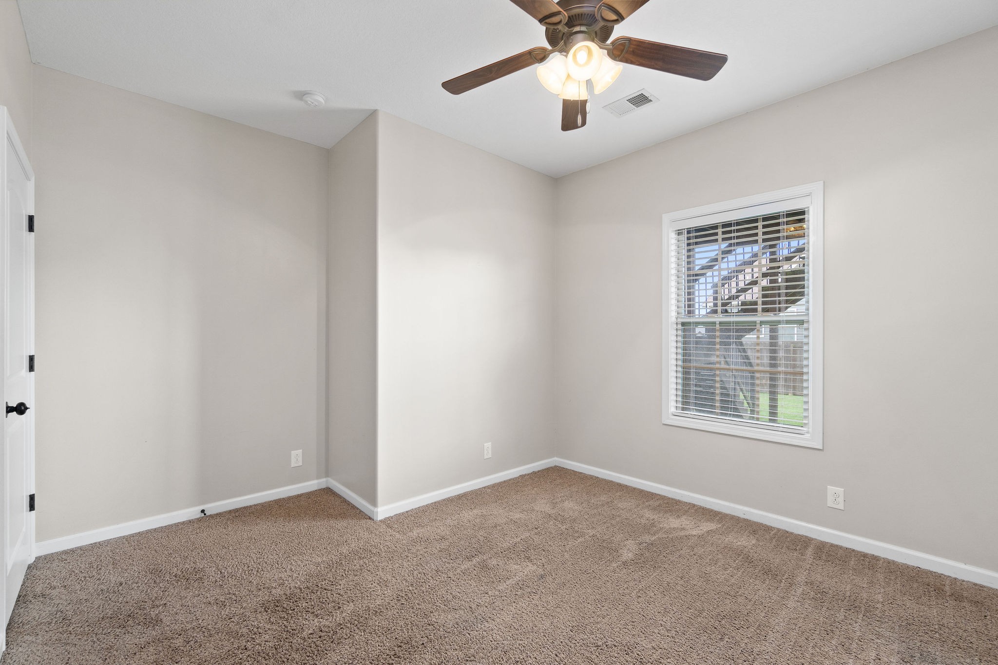 3768 Suiter Road Clarksville, TN 37040 - Photo 24 of 28 an empty room with a window and a ceiling fan