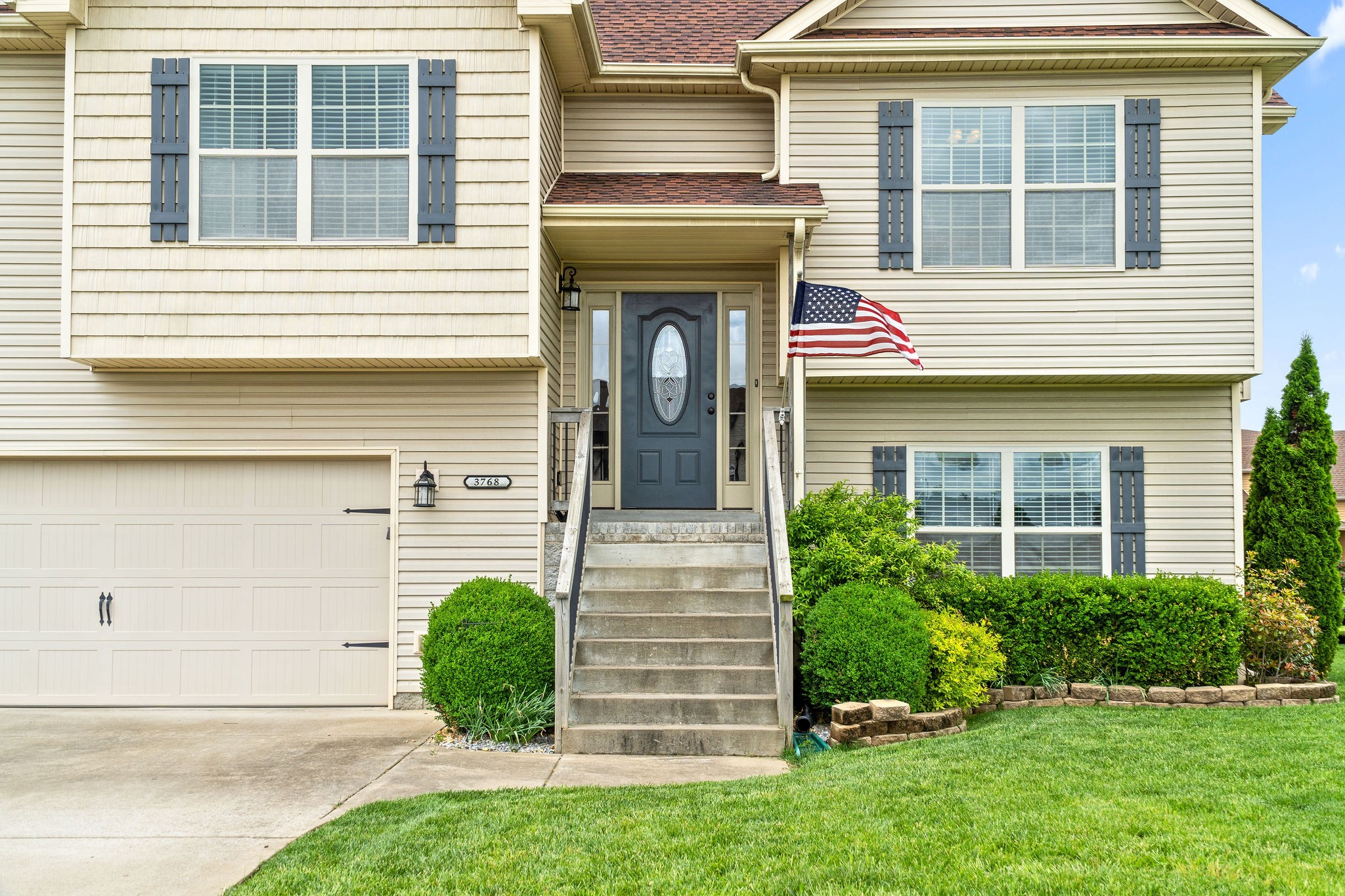 3768 Suiter Road Clarksville, TN 37040 - Photo 4 of 28 a view of a house with potted plants and a yard