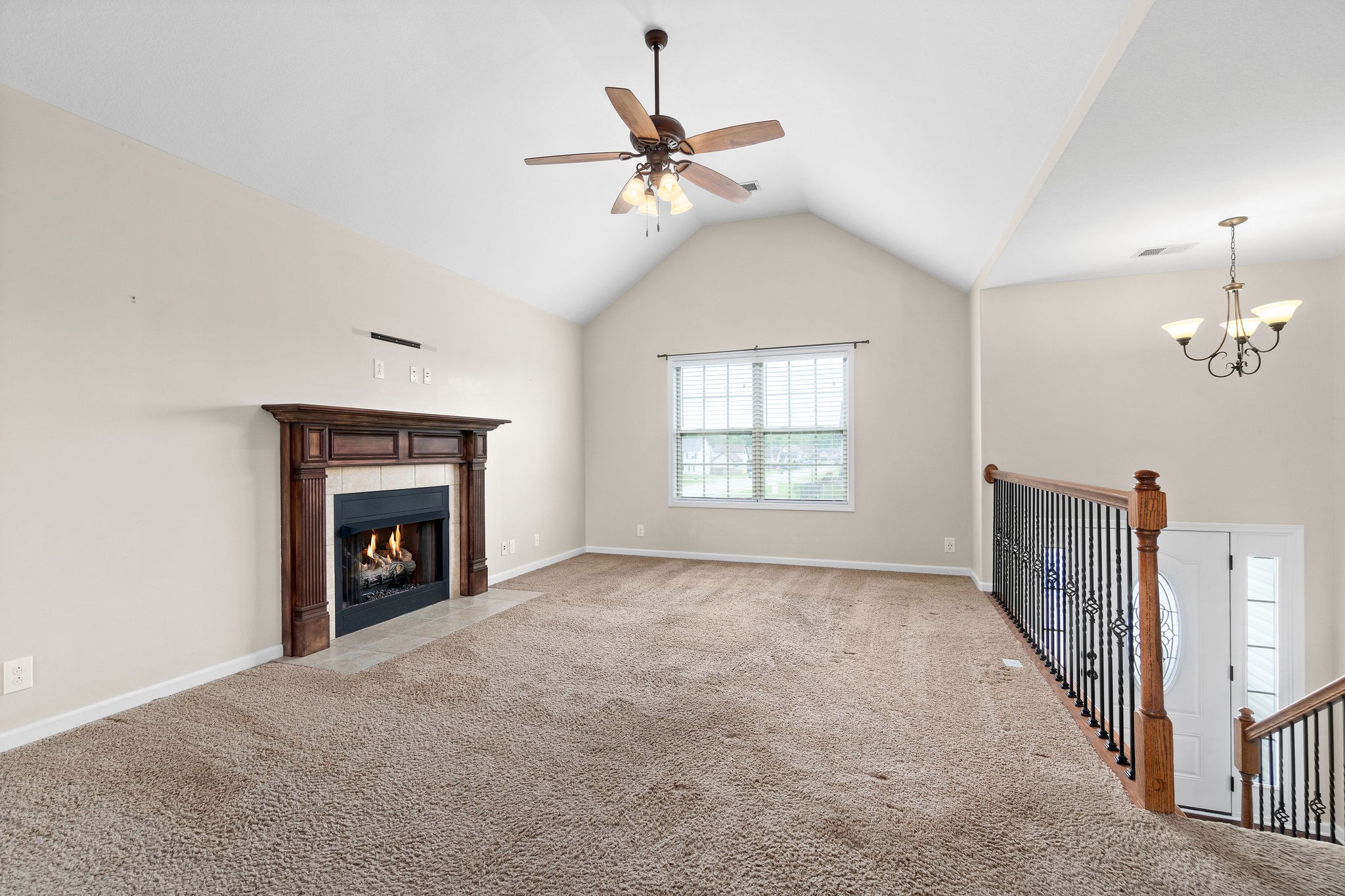 3768 Suiter Road Clarksville, TN 37040 - Photo 6 of 28 an empty room with windows and fireplace