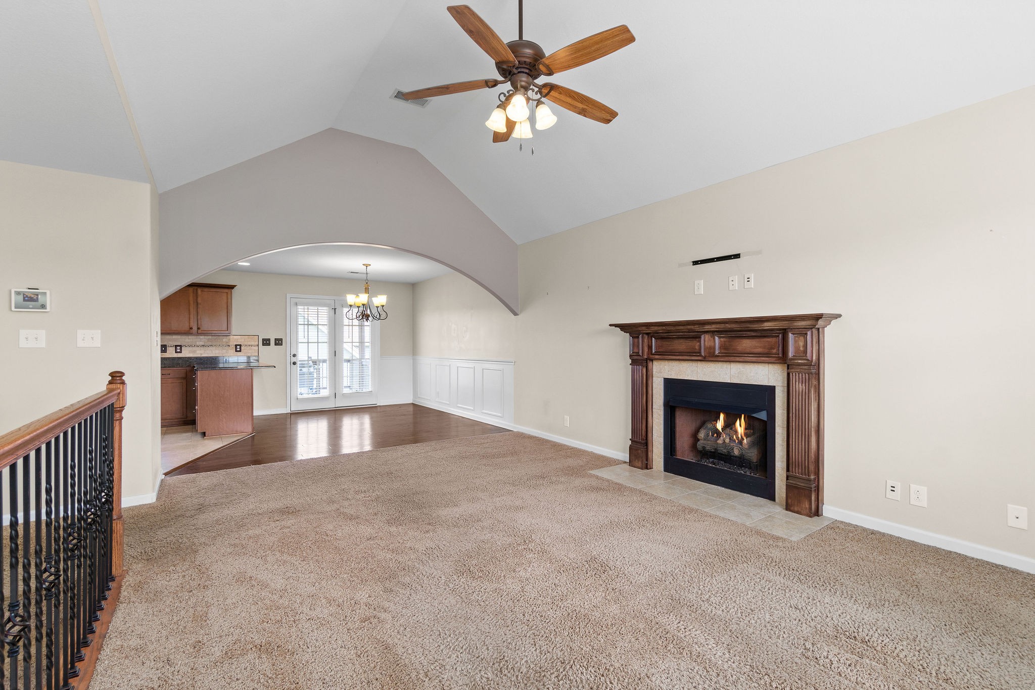 3768 Suiter Road Clarksville, TN 37040 - Photo 8 of 28 a view of empty room with kitchen and fireplace