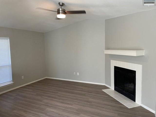 10616 Mellow Meadow Drive, Unit 43C Austin, TX 78750 - Photo 5 of 9 wooden floor fireplace and window in an empty room