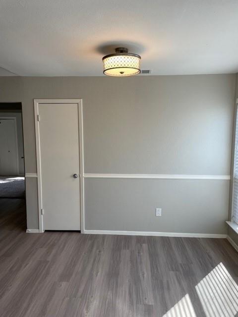 10616 Mellow Meadow Drive, Unit 43C Austin, TX 78750 - Photo 6 of 9 an empty room with wooden floor and windows