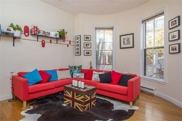 214 West Canton Street, Unit 2 Boston, MA 02116 - Photo 1 of 1 a living room with furniture a couch and a window