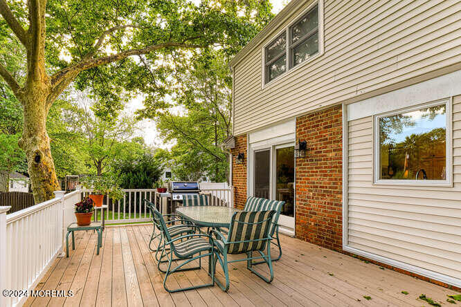 38 Carolyn Road Little Silver, NJ 07739 - Photo 8 of 31 a view of a chair and table on the deck