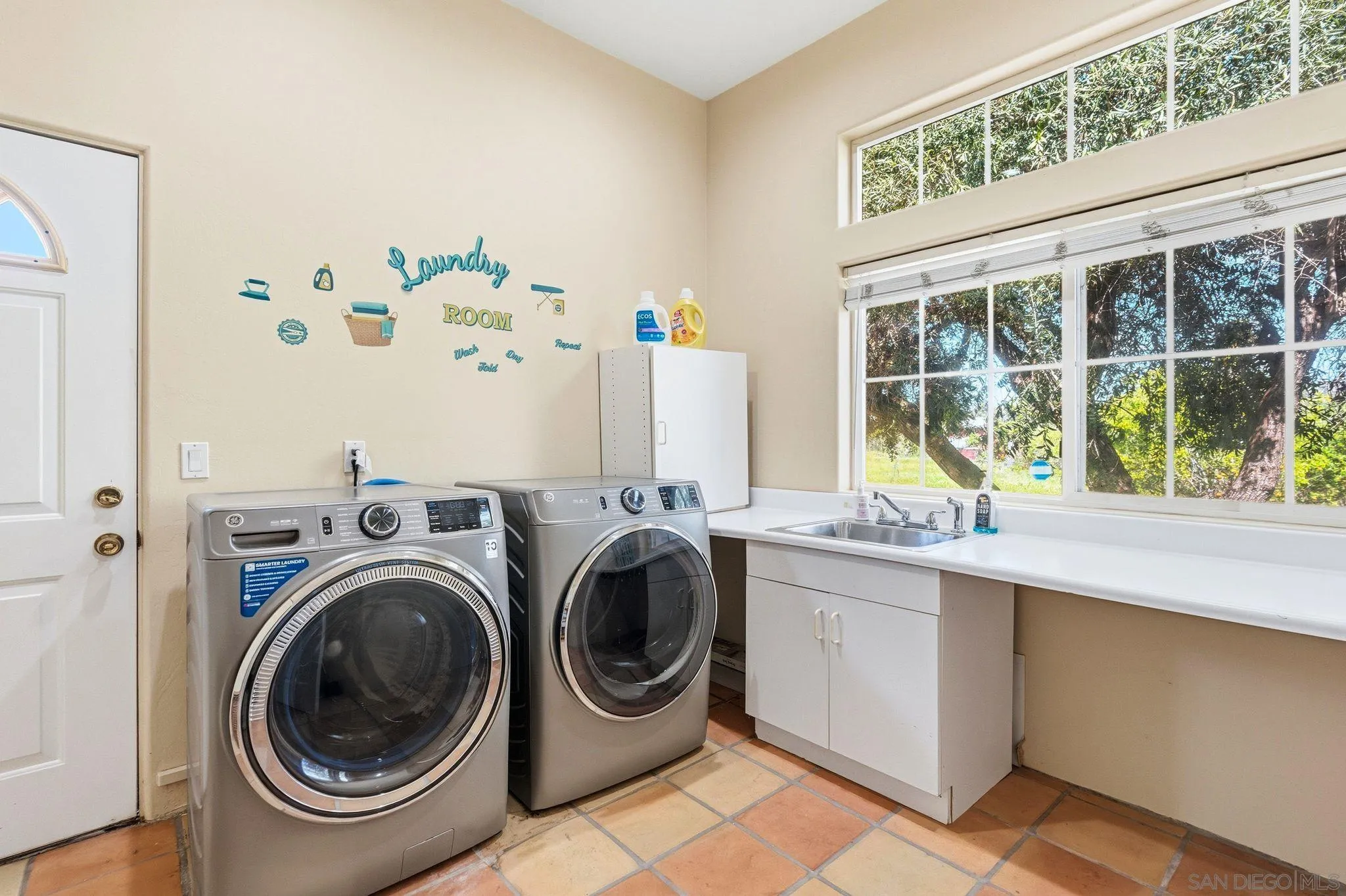 1035 Sleeping Indian Road Oceanside, CA 92057 - Photo 12 of 22 a utility room with sink dryer and washer