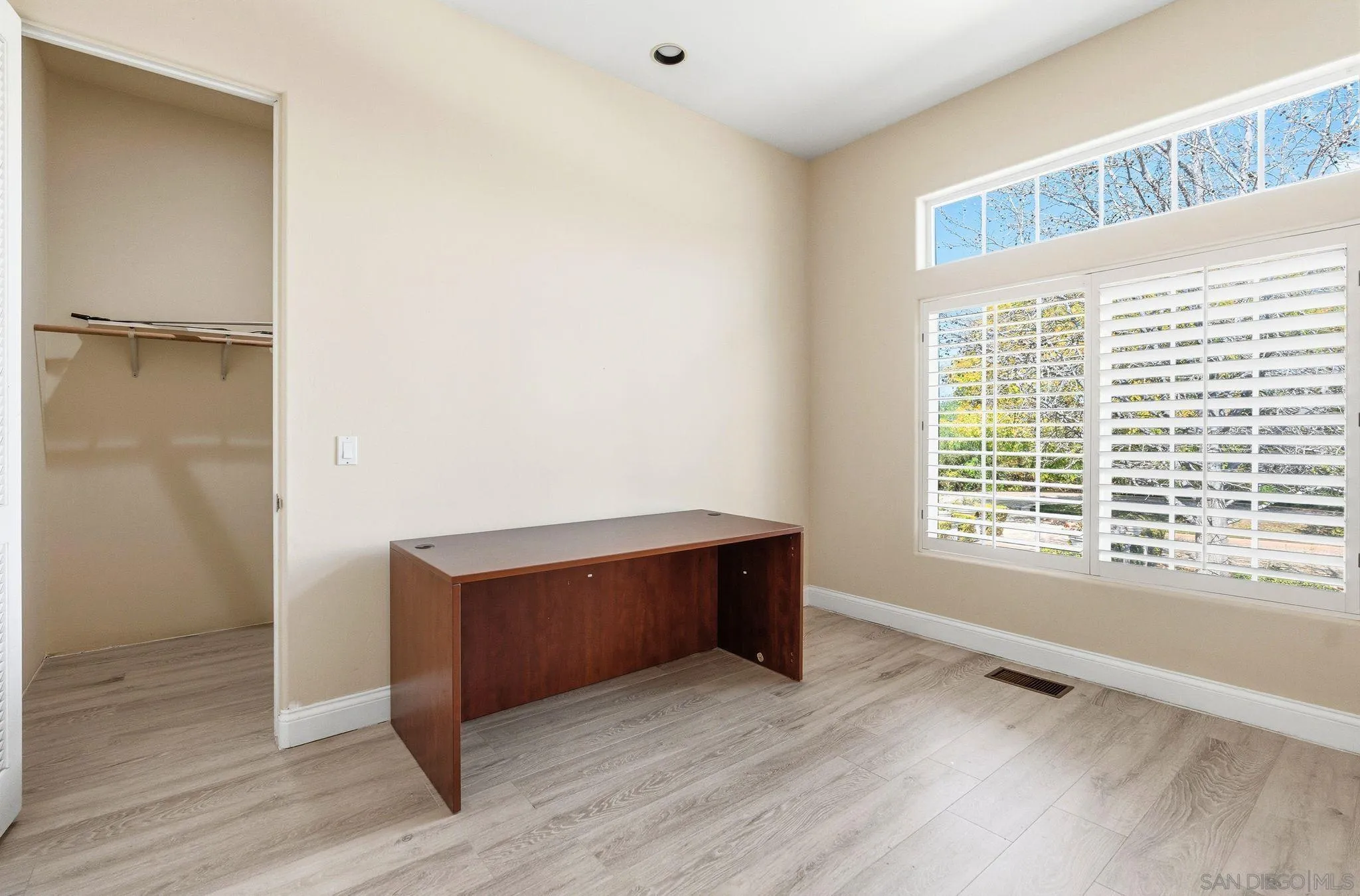 1035 Sleeping Indian Road Oceanside, CA 92057 - Photo 15 of 22 a room with wooden floor and windows