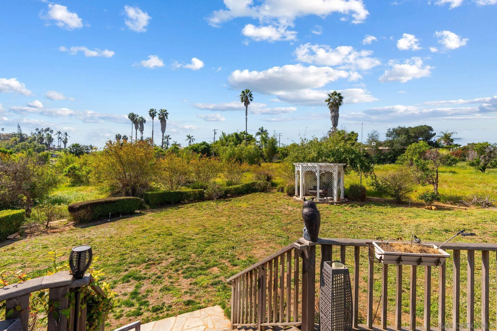 1035 Sleeping Indian Road Oceanside, CA 92057 - Photo 17 of 22 a view of a yard and ocean view