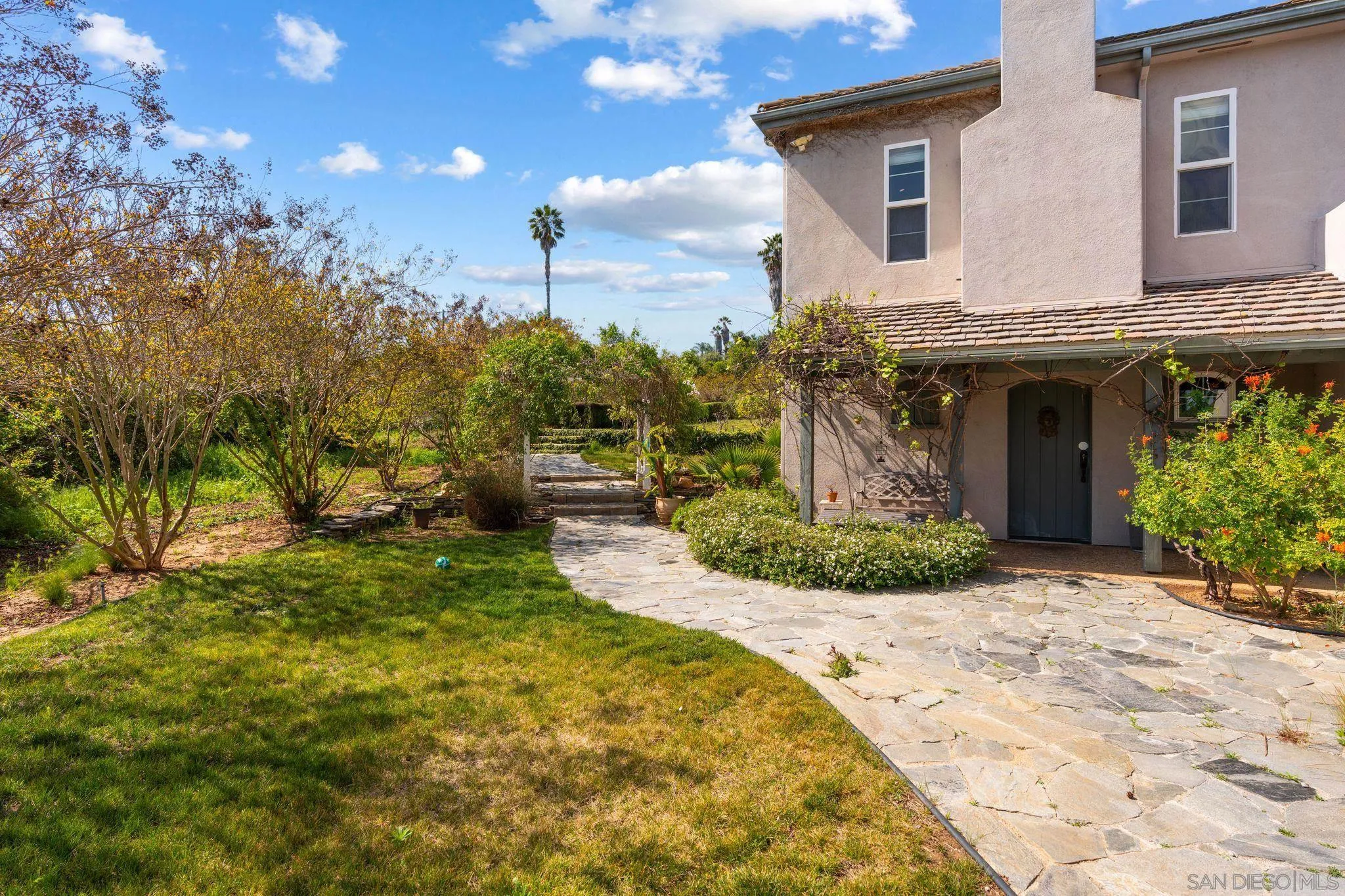 1035 Sleeping Indian Road Oceanside, CA 92057 - Photo 18 of 22 a front view of a house with garden