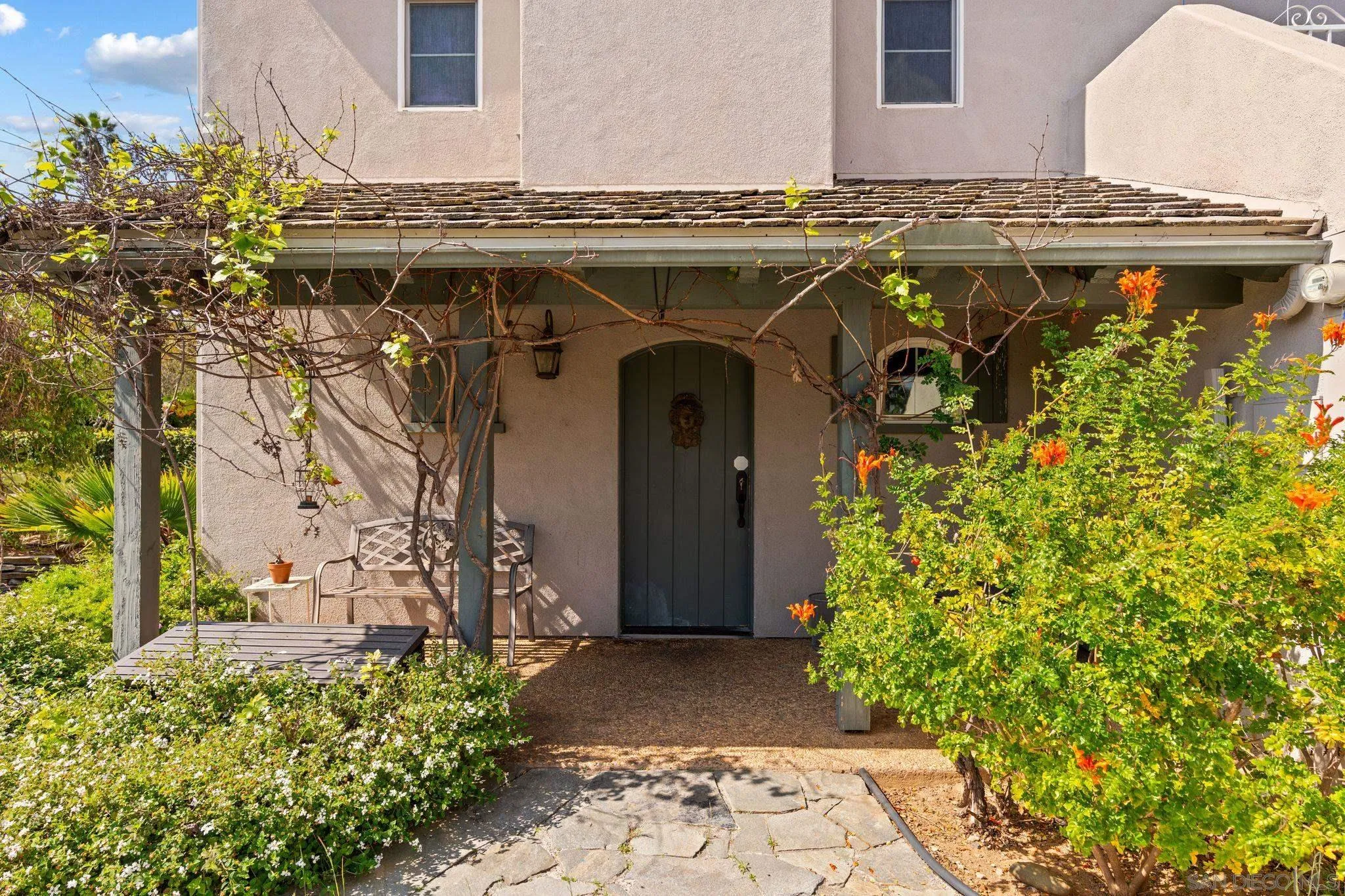 1035 Sleeping Indian Road Oceanside, CA 92057 - Photo 19 of 22 a front view of a house with garden