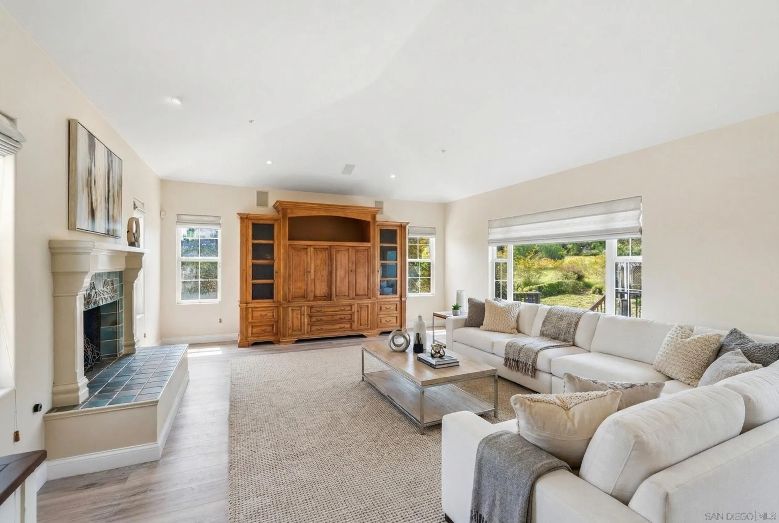 1035 Sleeping Indian Road Oceanside, CA 92057 - Photo 2 of 22 a living room with furniture and a fireplace
