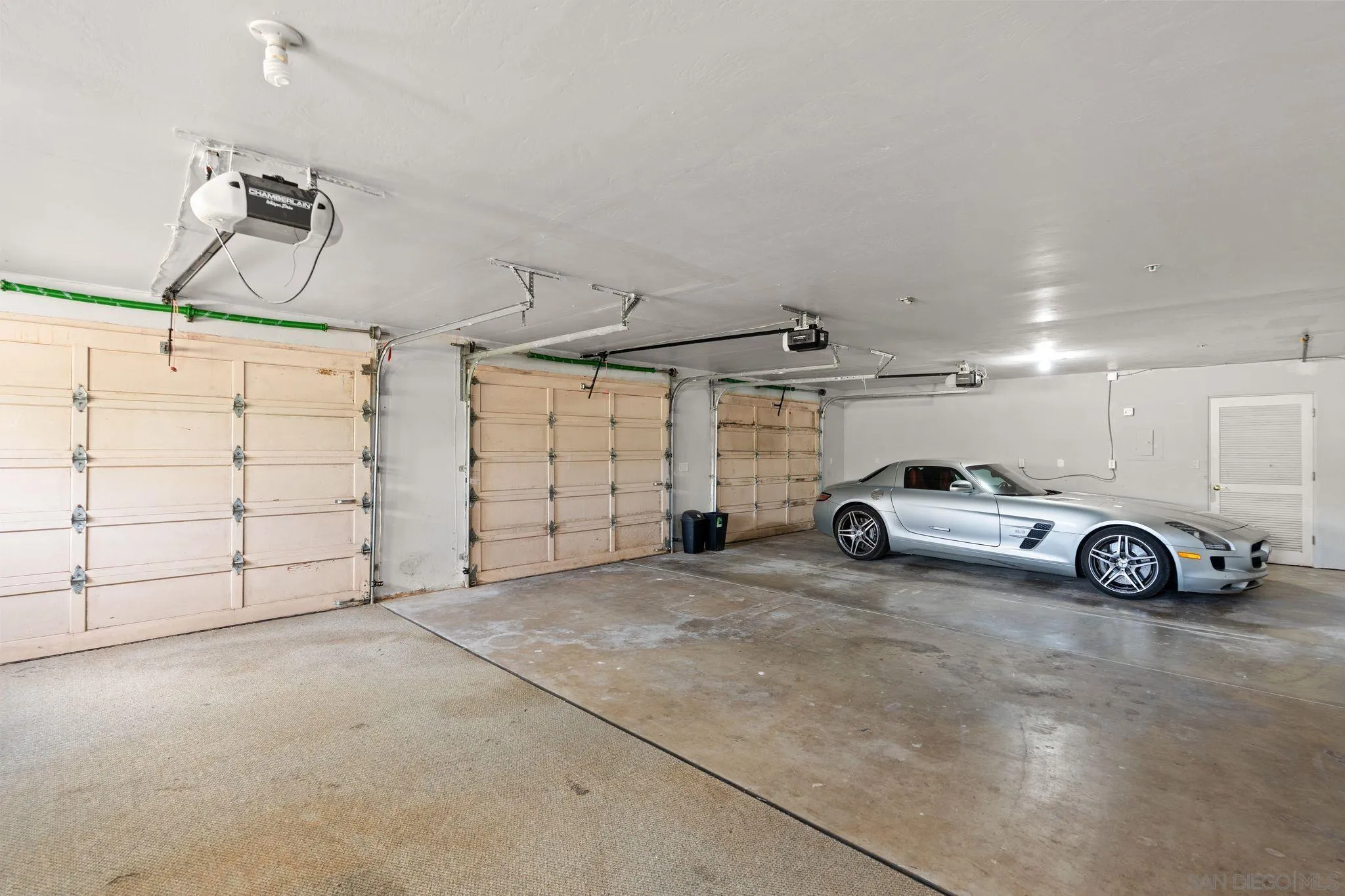1035 Sleeping Indian Road Oceanside, CA 92057 - Photo 21 of 22 a view of a garage and car parked