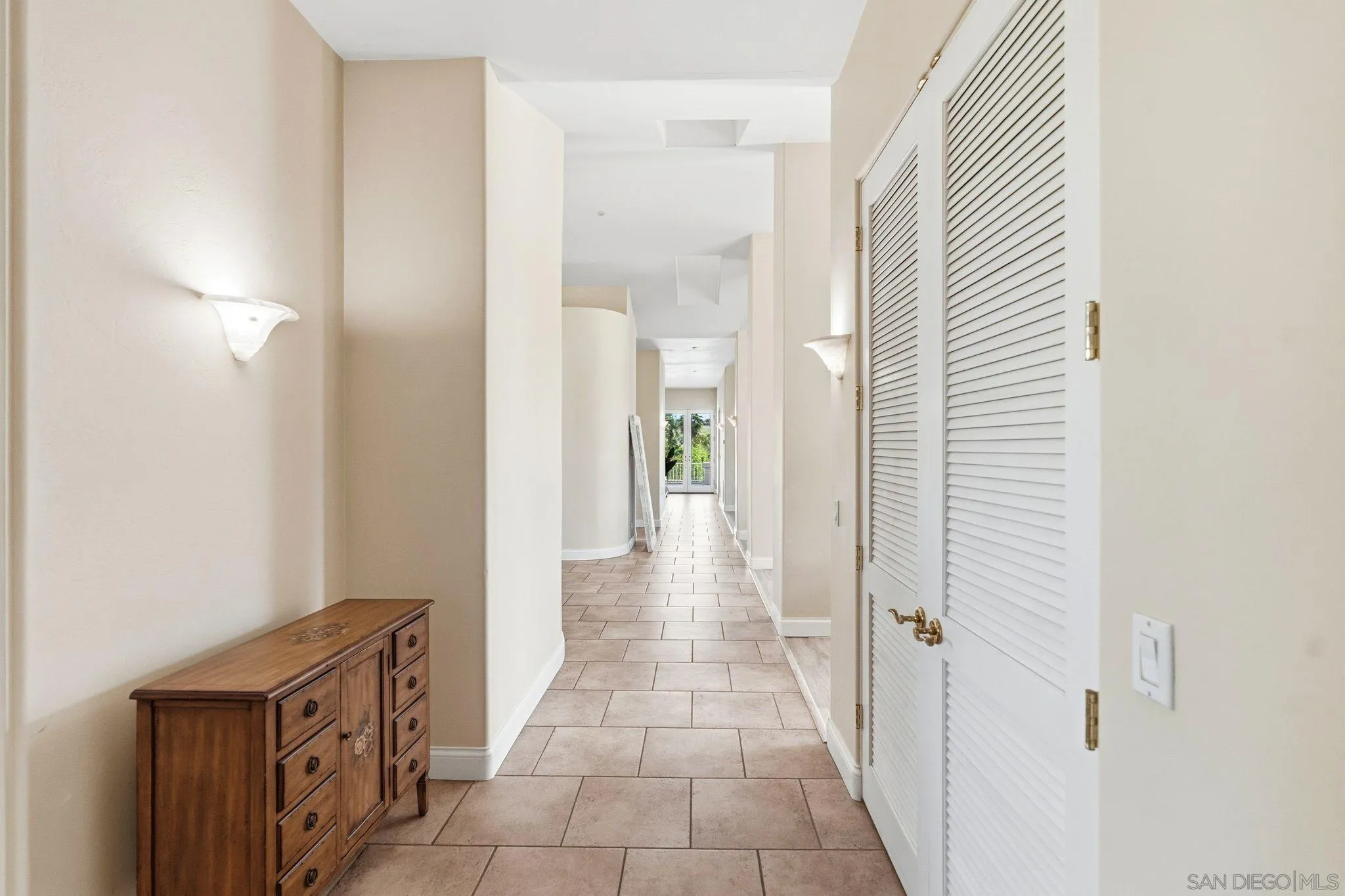 1035 Sleeping Indian Road Oceanside, CA 92057 - Photo 5 of 22 a view of a hallway with closet and a bathroom
