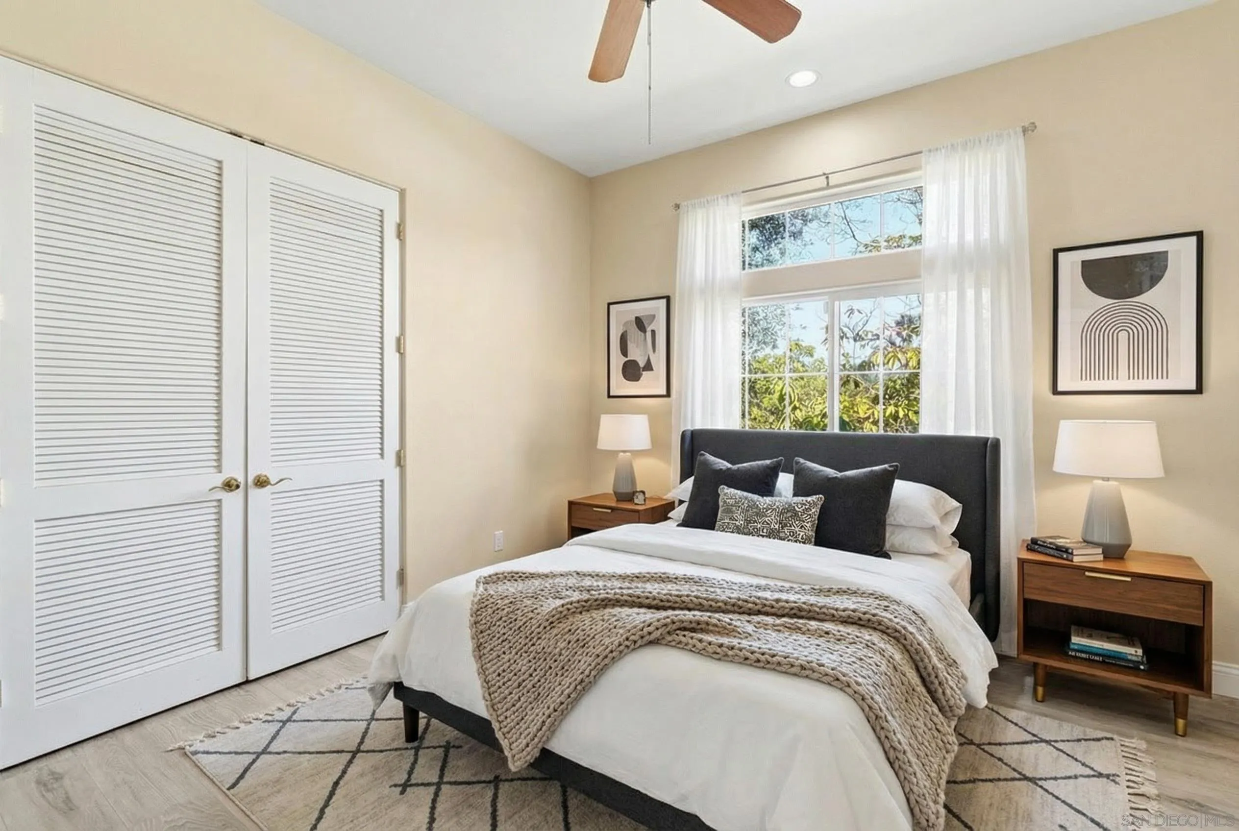 1035 Sleeping Indian Road Oceanside, CA 92057 - Photo 10 of 22 a bedroom with a bed and wooden floor