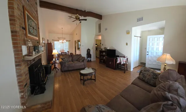 a living room with furniture and a fireplace