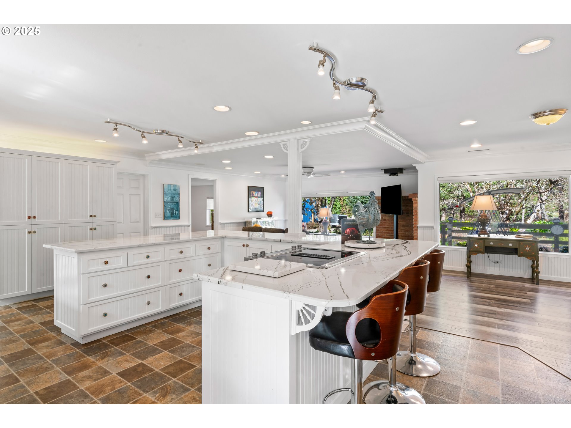 9202 Phey Lane Florence, OR 97439 - Photo 11 of 47 a kitchen with stainless steel appliances kitchen island granite countertop a sink and cabinets