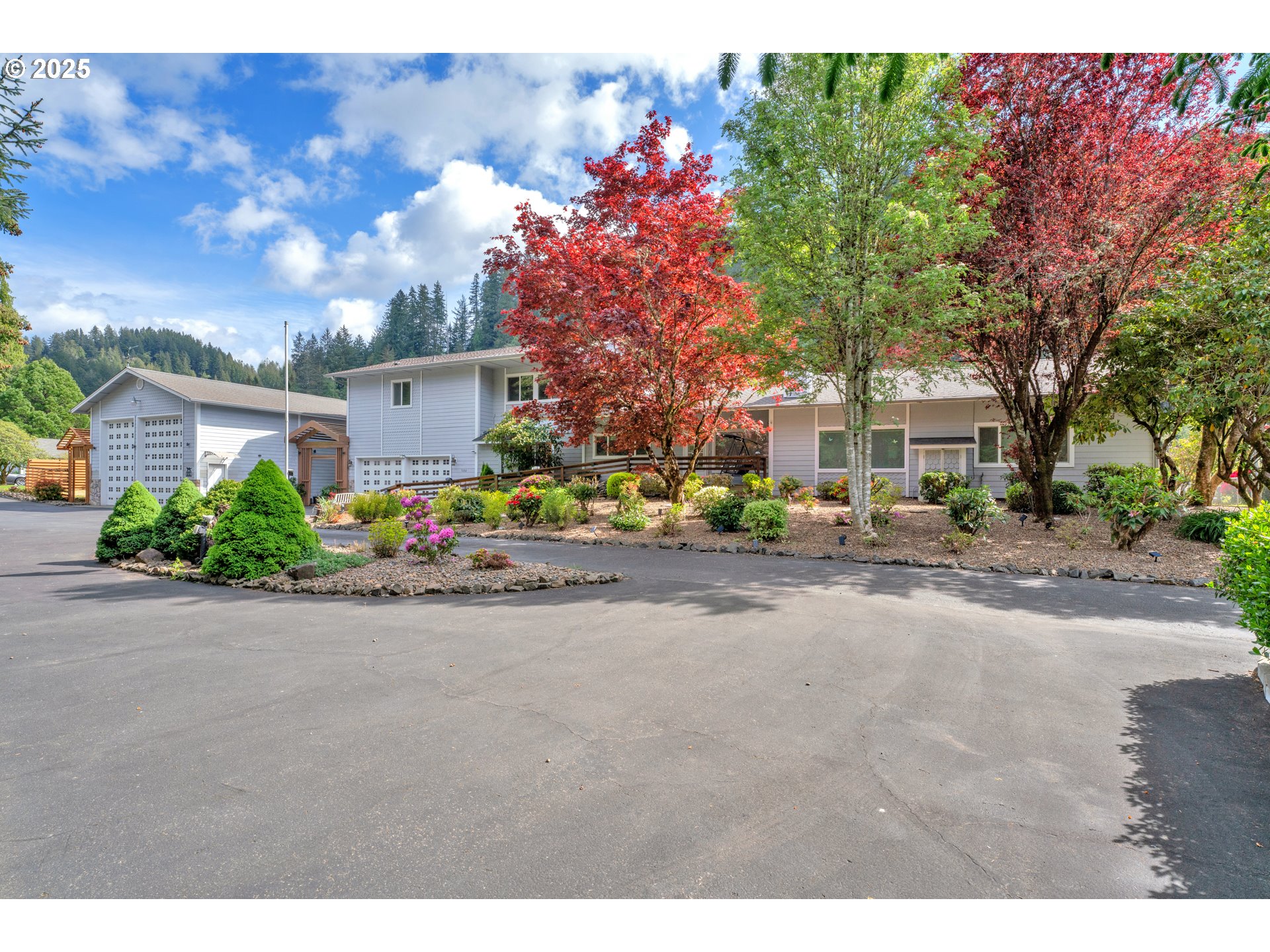 9202 Phey Lane Florence, OR 97439 - Photo 2 of 47 a front view of a house with a yard and a garage