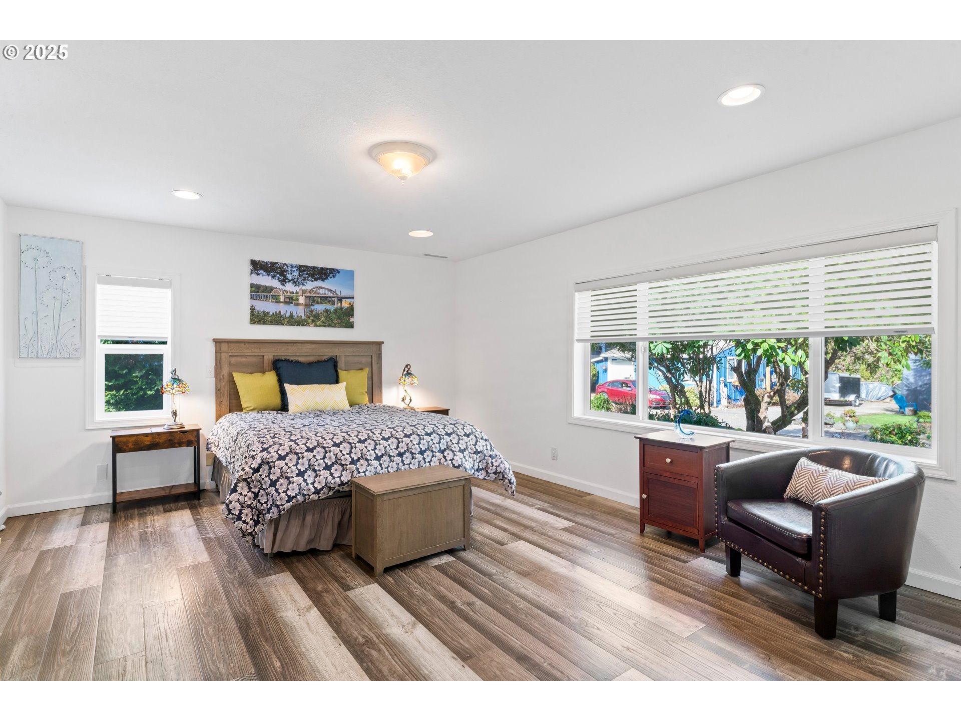 9202 Phey Lane Florence, OR 97439 - Photo 21 of 47 a bedroom with a bed a couch and a window with outer view