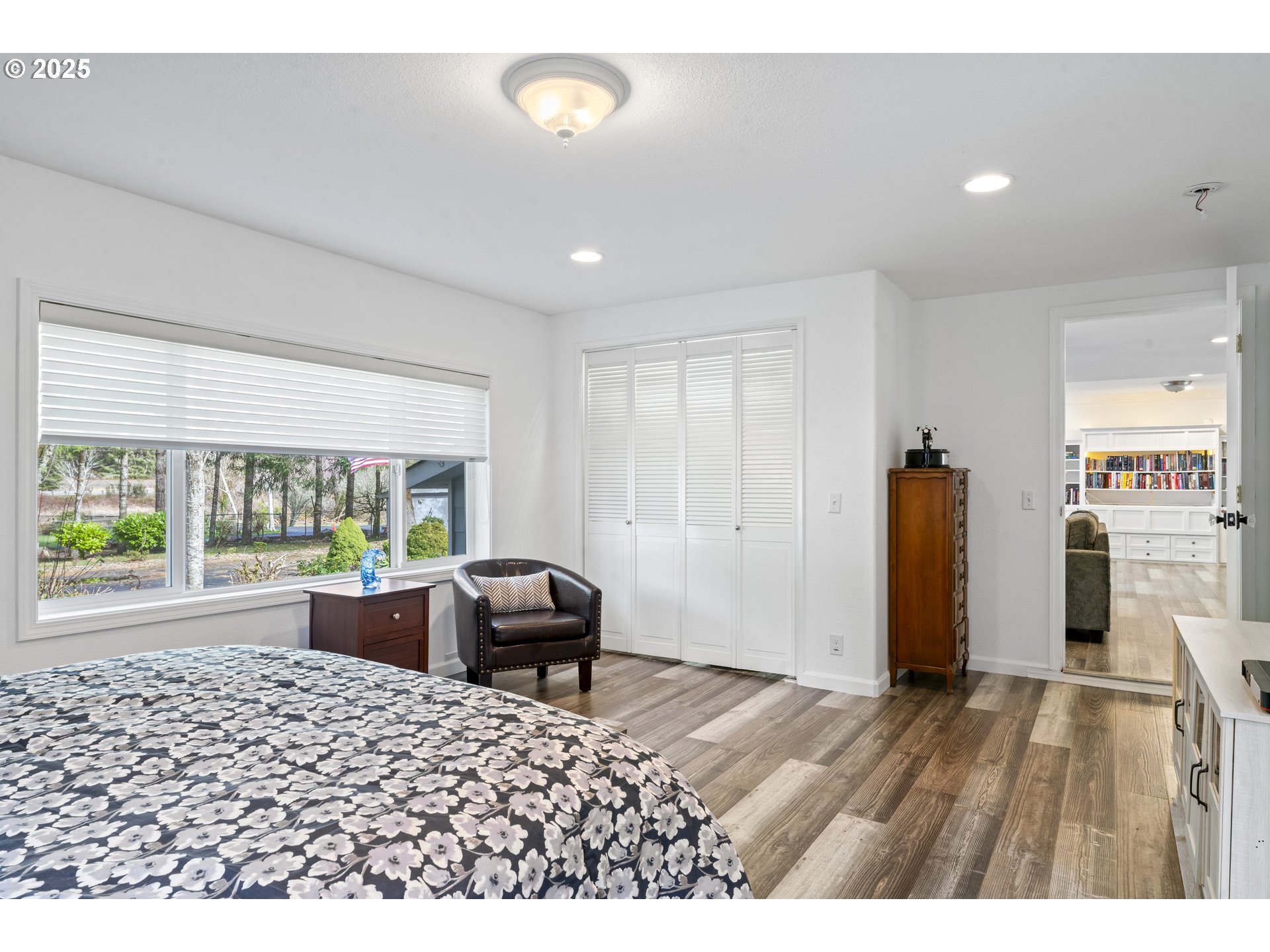 9202 Phey Lane Florence, OR 97439 - Photo 23 of 47 a living room with furniture a large window and wooden floor