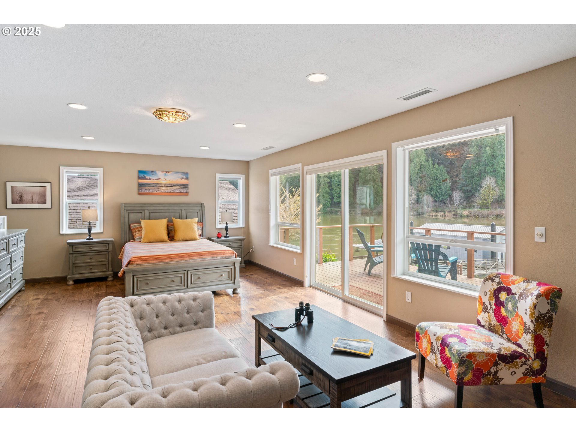 9202 Phey Lane Florence, OR 97439 - Photo 34 of 47 a bedroom with furniture and a large window