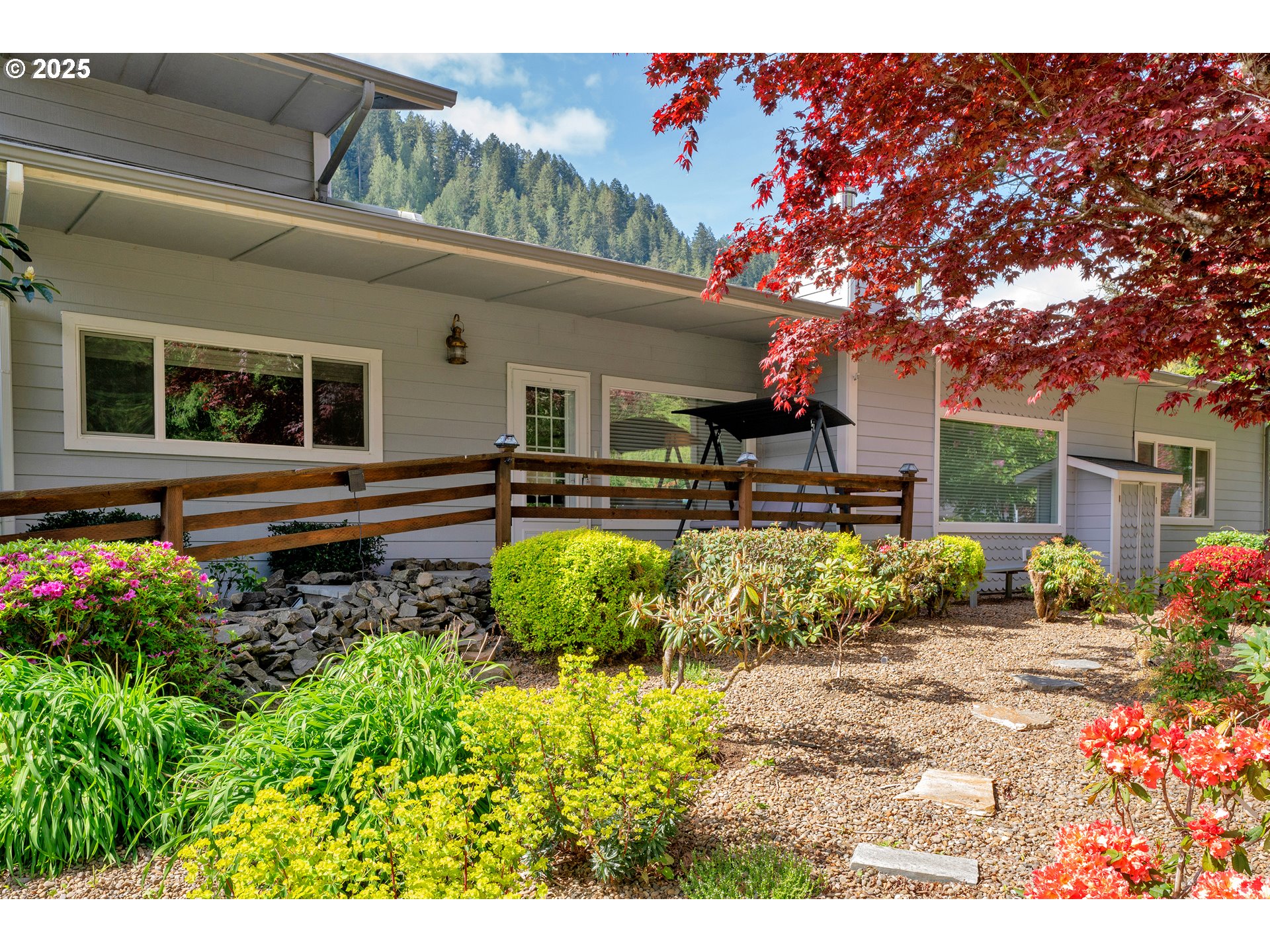 9202 Phey Lane Florence, OR 97439 - Photo 4 of 47 a front view of a house with garden
